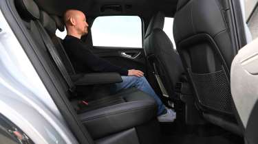 Audi Q4 e-tron - rear seats with Auto Express Chief reviewer, Alex Ingram